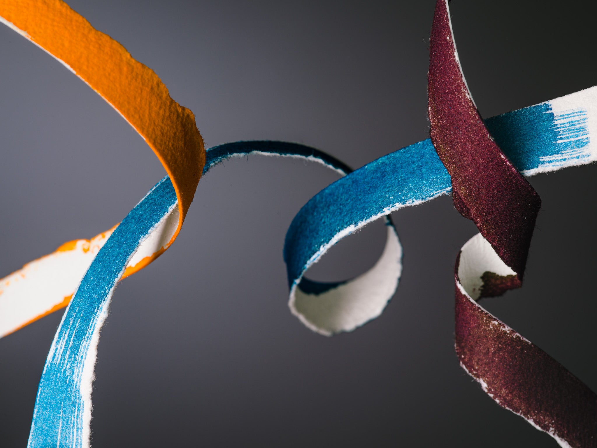 Sculptural close-up of torn paper ribbons inked in Iroshizuku’s new To-ro, Rikka, and Syun-gyo colors. Photographed by Toronto-based still life photographer Nicholas Hyatt.