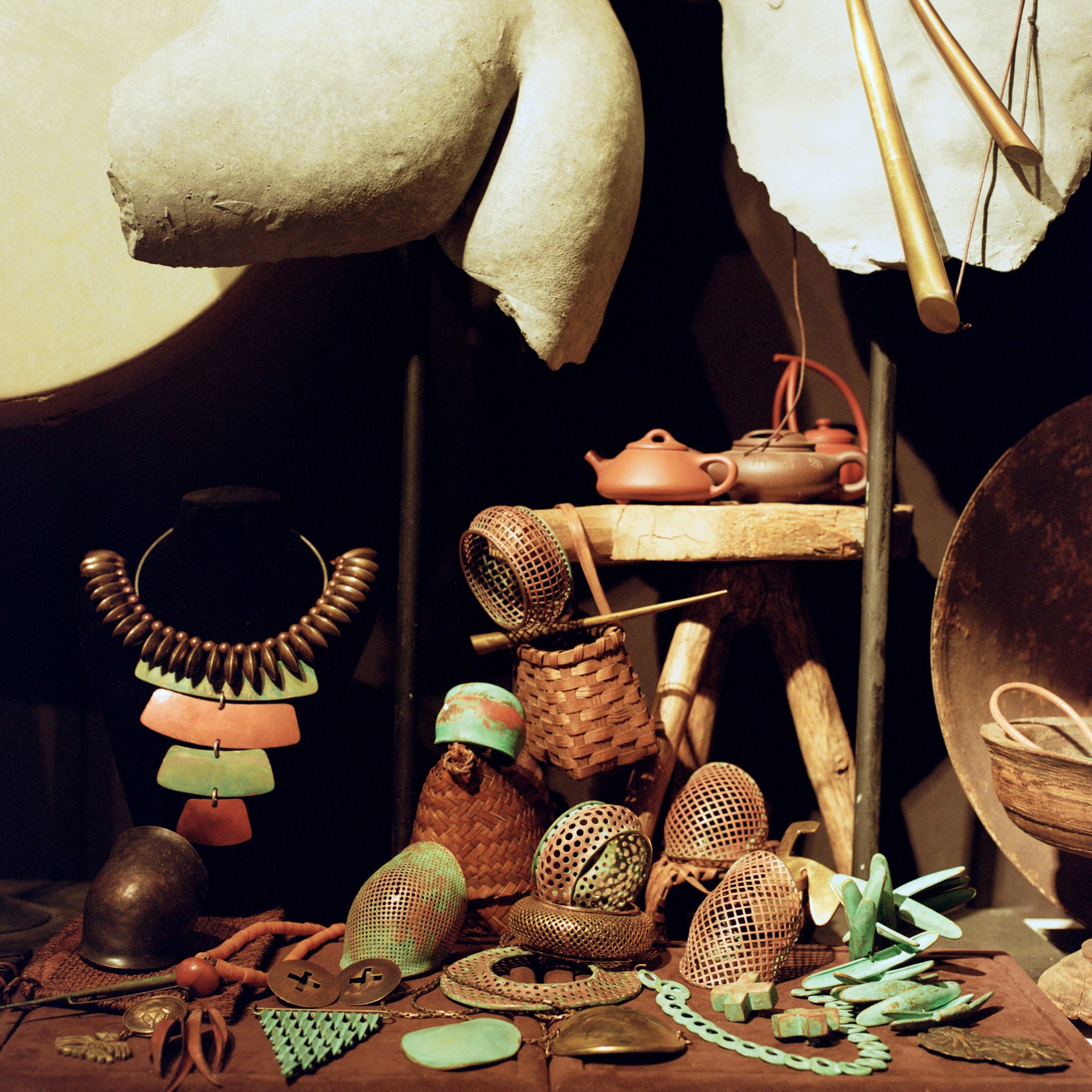Still life photograph of Robert Lee Morris’ studio featuring handcrafted jewelry, metalwork, sculptural forms, and rustic objects. Captured by Toronto-based photographer Nicholas Hyatt, this image blends artisanal design with natural textures in a warm, moody lighting setup.